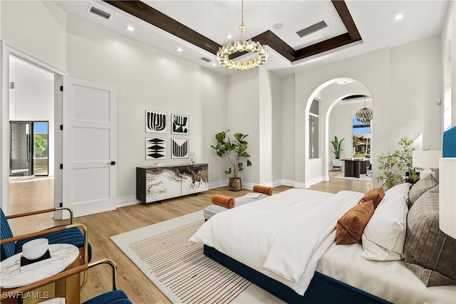 4831 Conover Ct, Fort Myers, FL 33908 - bedroom with baseboards, light wood-style flooring, visible vents, and an inviting chandelier