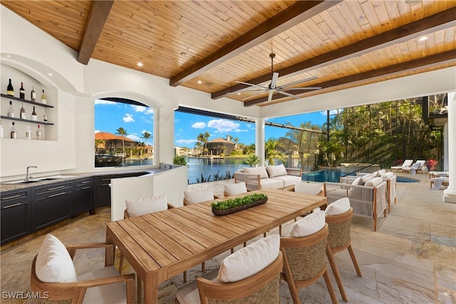 4831 Conover Ct, Fort Myers, FL 33908 - view of patio with an outdoor living space, a sink, outdoor dining space, a water view, and ceiling fan