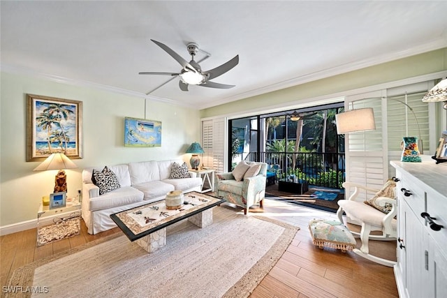 living room with wood-type flooring, ceiling fan, and ornamental molding