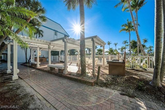 view of patio / terrace with fence and a pergola