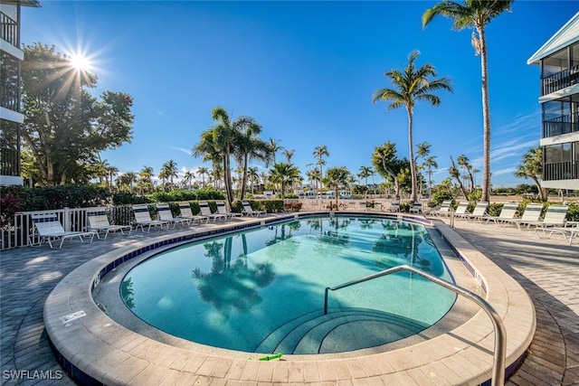 community pool with a patio area