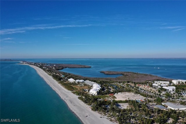 bird's eye view with a water view and a view of the beach