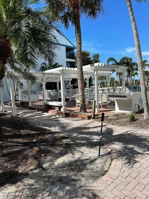 view of home's community with a patio and a pergola