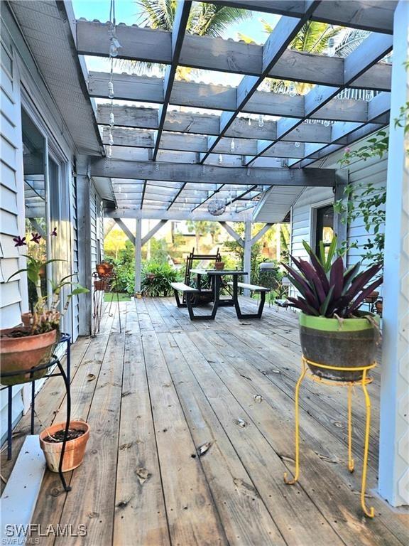 wooden terrace featuring a pergola