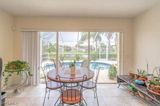 7639 Novara Ct, Naples, FL 34114 - dining space featuring a sunroom, light tile patterned floors, and plenty of natural light