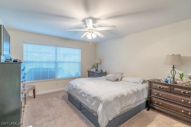 7639 Novara Ct, Naples, FL 34114 - bedroom featuring baseboards, ceiling fan, and light colored carpet