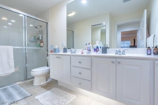 7639 Novara Ct, Naples, FL 34114 - bathroom with double vanity, a sink, toilet, and a shower stall