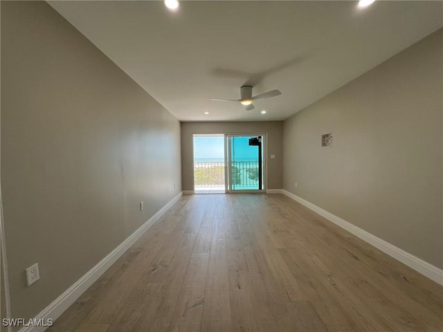 spare room with recessed lighting, ceiling fan, baseboards, and light wood-style floors