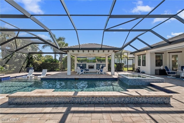 view of swimming pool featuring a patio, a pool with connected hot tub, and a lanai