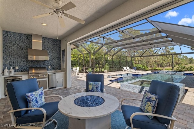 view of patio / terrace featuring an outdoor pool, a jacuzzi, area for grilling, and a lanai