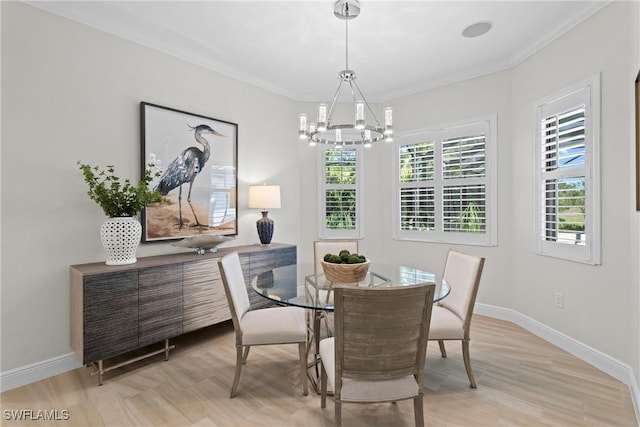 dining area featuring an inviting chandelier, a healthy amount of sunlight, and baseboards