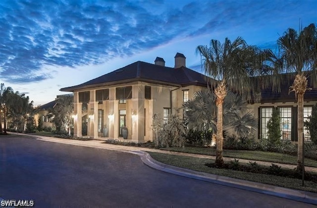 view of property at dusk