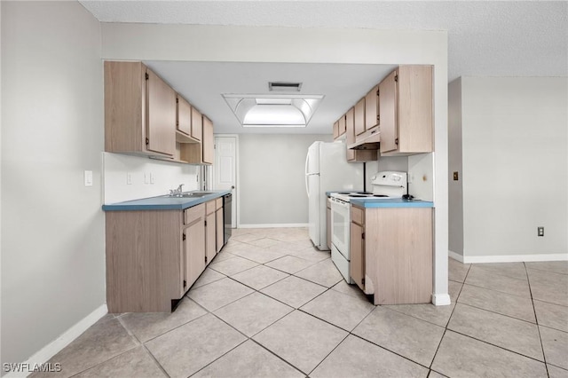 kitchen featuring baseboards, white appliances, visible vents, and light tile patterned flooring