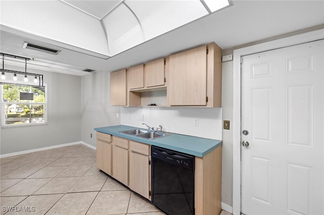 kitchen with light brown cabinetry, visible vents, black dishwasher, and a sink