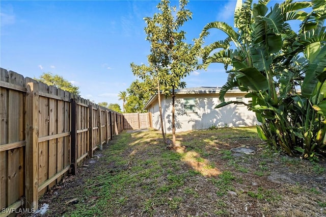 view of yard with a fenced backyard