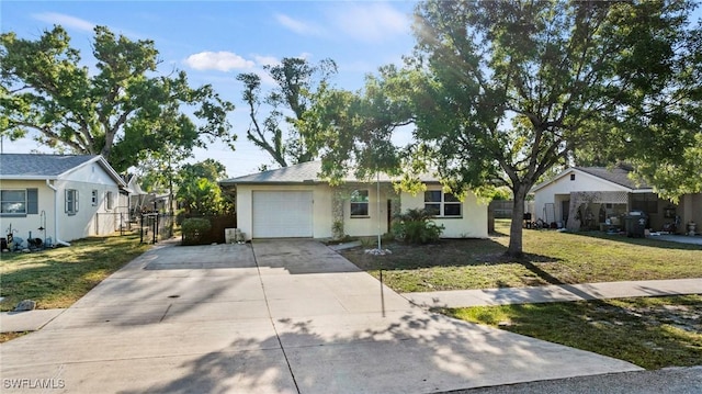 ranch-style house featuring a front lawn, fence, concrete driveway, stucco siding, and an attached garage