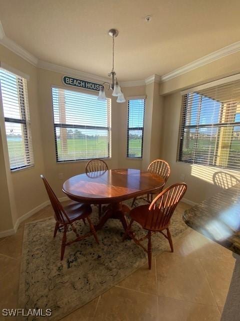 dining space featuring an inviting chandelier, light tile patterned floors, baseboards, and ornamental molding