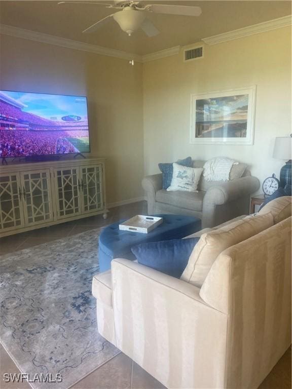 living area featuring tile patterned flooring, visible vents, crown molding, and ceiling fan