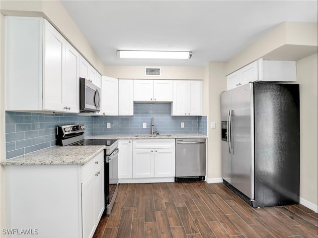 3 Knights Bridge Rd Unit A2, Naples, FL 34112 - kitchen featuring stainless steel appliances, a sink, and white cabinets