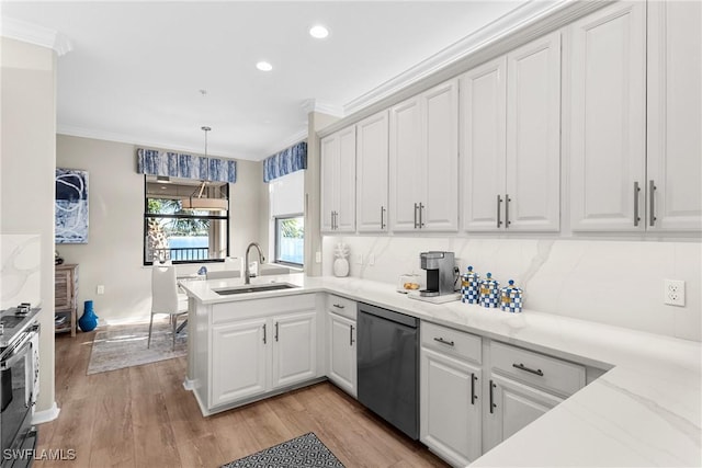 kitchen with ornamental molding, a sink, a peninsula, white cabinets, and dishwashing machine