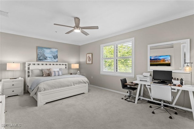 bedroom with visible vents, baseboards, carpet, and crown molding