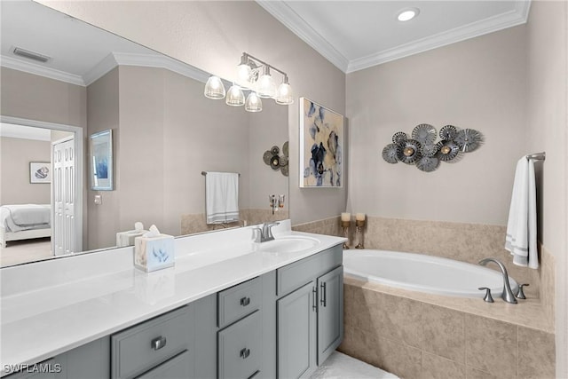 bathroom featuring vanity, crown molding, a bath, and visible vents