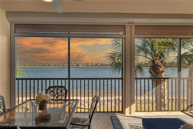 sunroom / solarium with a water view