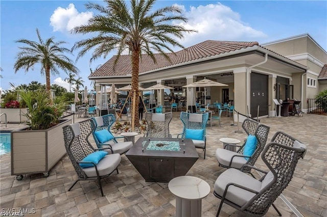 view of patio / terrace featuring a fire pit