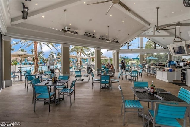 view of patio featuring outdoor dining area and a ceiling fan