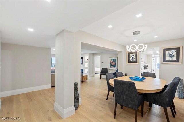 dining room with recessed lighting, light wood-type flooring, and baseboards