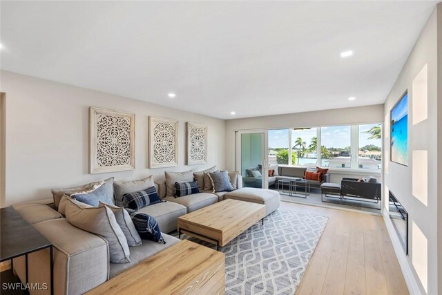living room featuring recessed lighting and light wood-type flooring