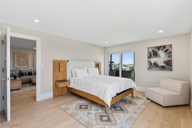 bedroom with access to outside, recessed lighting, light wood-style floors, and baseboards