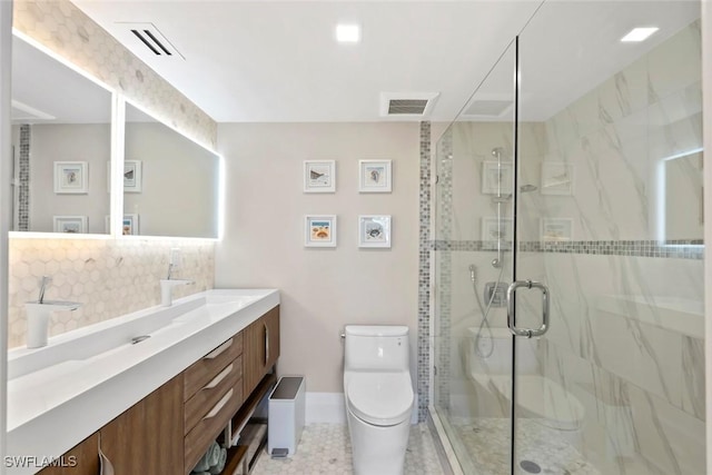 bathroom with visible vents, vanity, toilet, and a shower stall