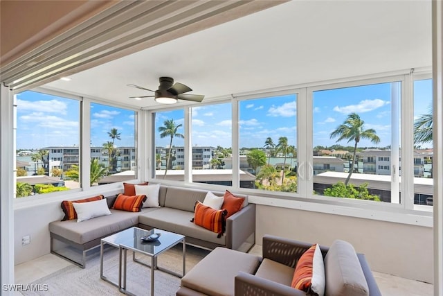 sunroom featuring ceiling fan