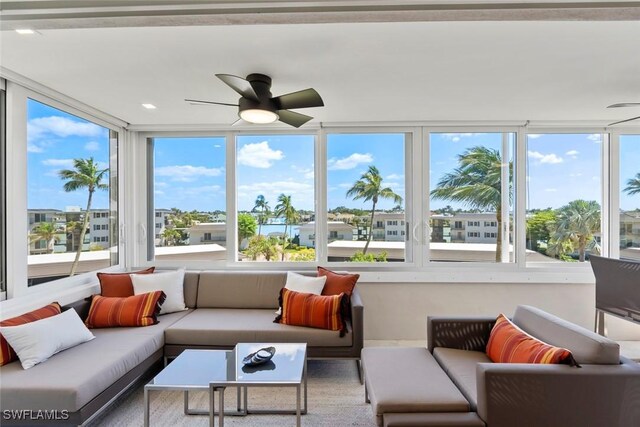 sunroom with a ceiling fan