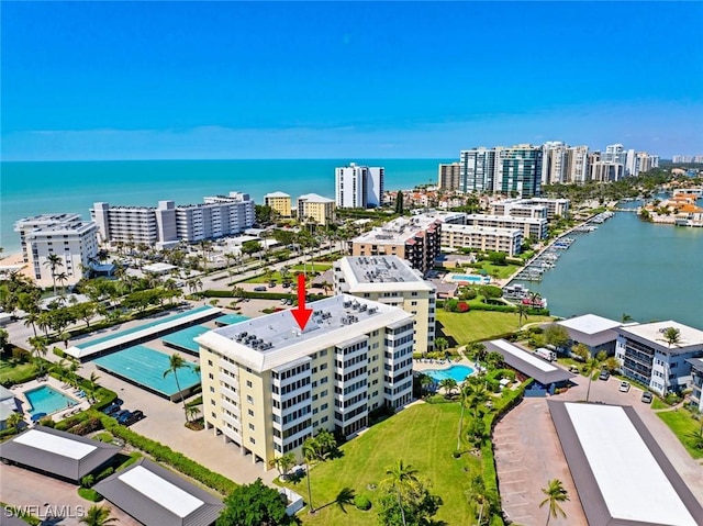 aerial view featuring a city view and a water view