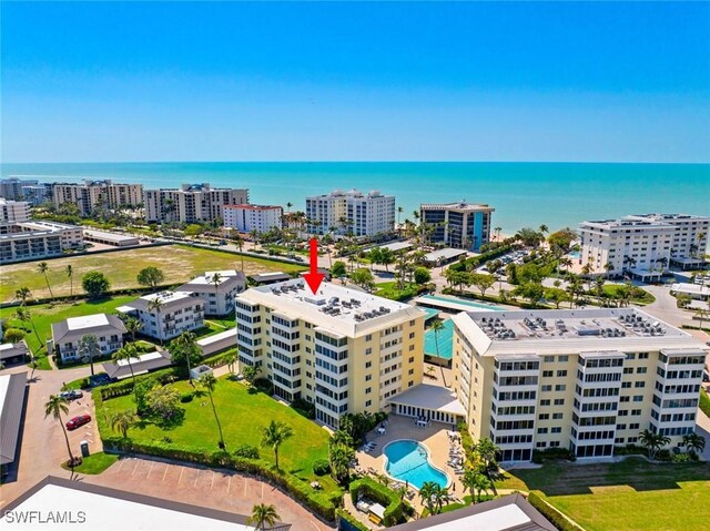 drone / aerial view with a water view and a city view