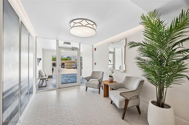 sitting room featuring baseboards