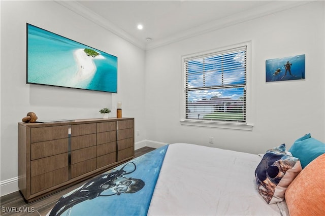 bedroom with recessed lighting, baseboards, wood finished floors, and crown molding