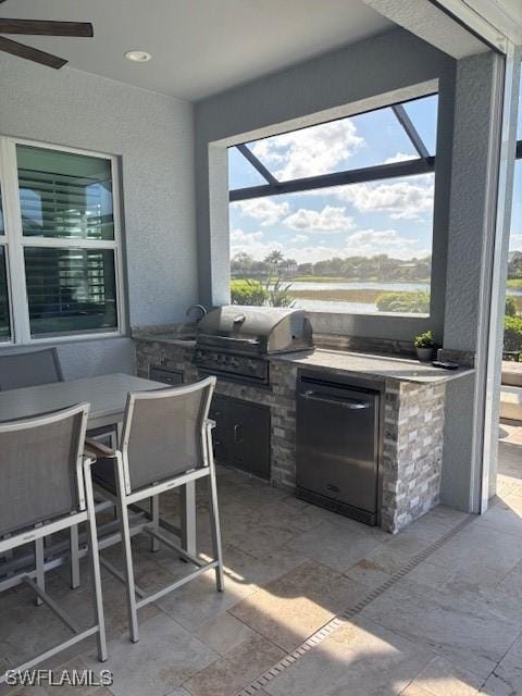 view of patio / terrace featuring a lanai, grilling area, an outdoor kitchen, and outdoor dining area