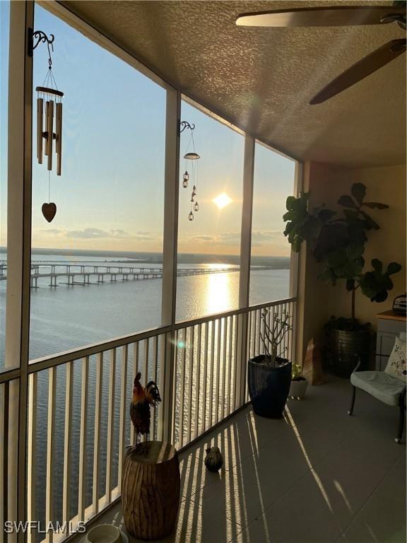 balcony featuring a water view