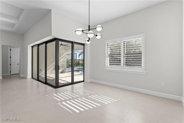 unfurnished dining area featuring a chandelier, coffered ceiling, and baseboards