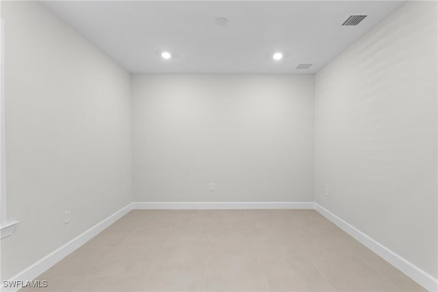 spare room featuring recessed lighting, baseboards, and visible vents