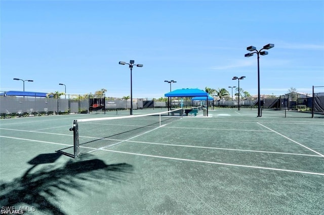 view of sport court with fence