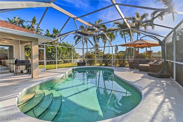 pool featuring outdoor lounge area, a lanai, a patio area, and a grill