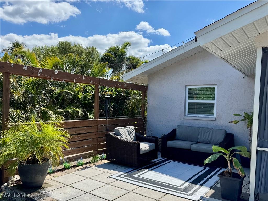 view of patio / terrace with outdoor lounge area and fence