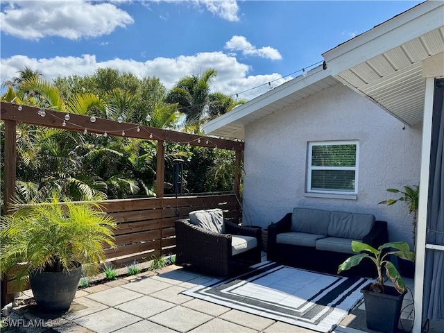 view of patio / terrace with outdoor lounge area and fence