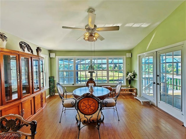 sunroom / solarium featuring french doors, a ceiling fan, and vaulted ceiling