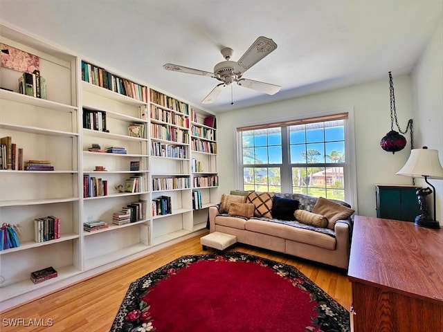 living area featuring ceiling fan and wood finished floors