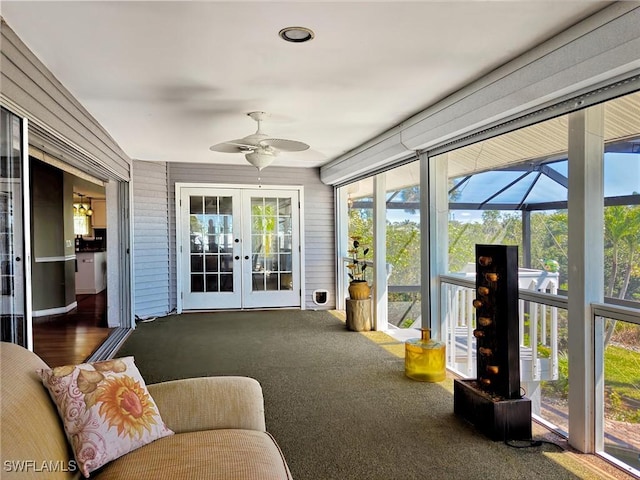 sunroom / solarium featuring french doors and a ceiling fan